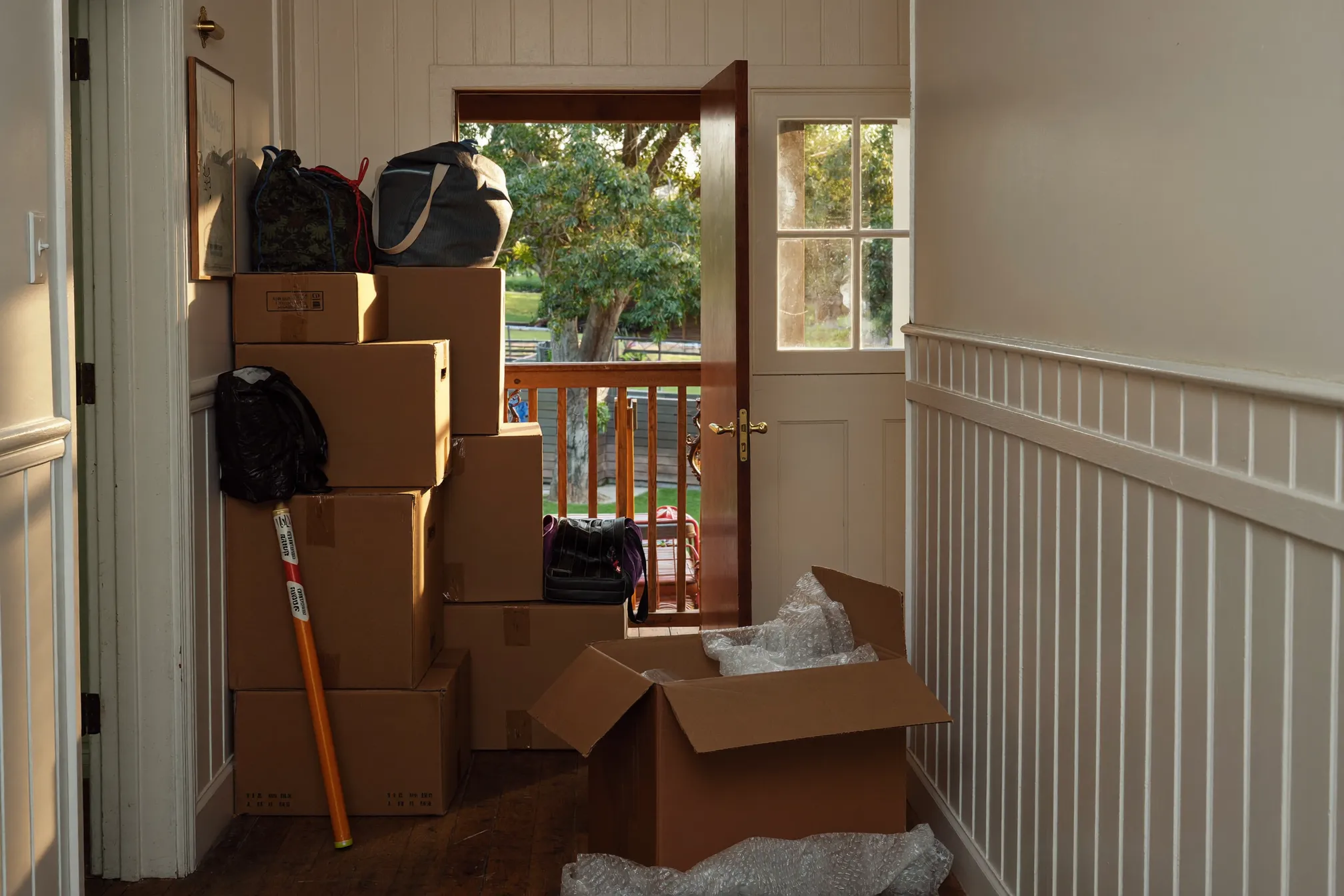 Moving boxes in the hallway of a Queenslander home